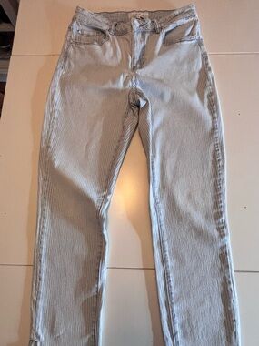 Blue and white pinstriped denim jeans